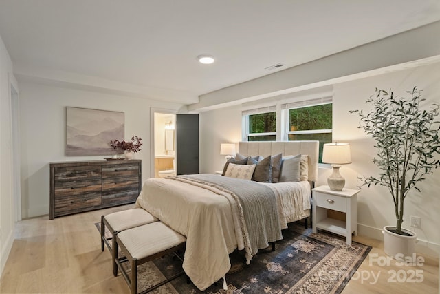 3326 Winterfield Pl, Charlotte, NC 28205 - bedroom featuring wood finished floors, connected bathroom, and baseboards
