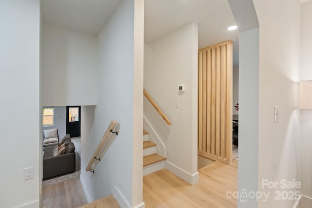 3326 Winterfield Pl, Charlotte, NC 28205 - staircase featuring wood finished floors, arched walkways, and recessed lighting