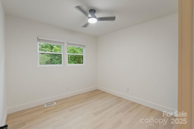3326 Winterfield Pl, Charlotte, NC 28205 - empty room with light wood-type flooring and a ceiling fan