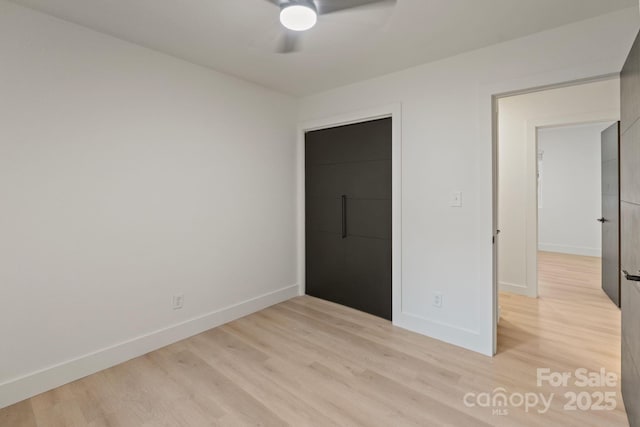 3326 Winterfield Pl, Charlotte, NC 28205 - unfurnished bedroom with light wood-style floors and a ceiling fan