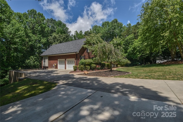 118 Tayport Dr, Troutman, NC 28166 - view of front of house featuring brick siding, driveway, a front lawn, an attached garage, and a shingled roof