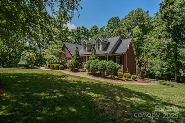 118 Tayport Dr, Troutman, NC 28166 - cape cod home featuring a front lawn