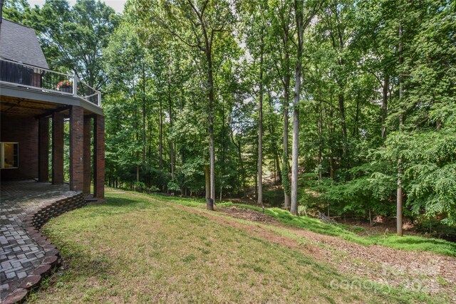 118 Tayport Dr, Troutman, NC 28166 - view of green lawn with a balcony