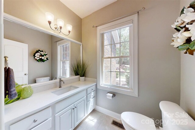 118 Tayport Dr, Troutman, NC 28166 - bathroom featuring toilet, plenty of natural light, vanity, and baseboards