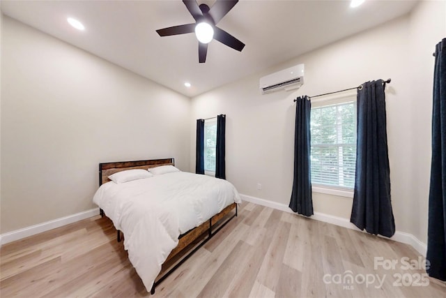 118 Tayport Dr, Troutman, NC 28166 - bedroom featuring a wall mounted air conditioner, light wood-type flooring, baseboards, recessed lighting, and ceiling fan