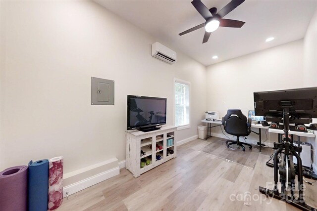 118 Tayport Dr, Troutman, NC 28166 - home office featuring an AC wall unit, electric panel, wood finished floors, baseboards, and recessed lighting