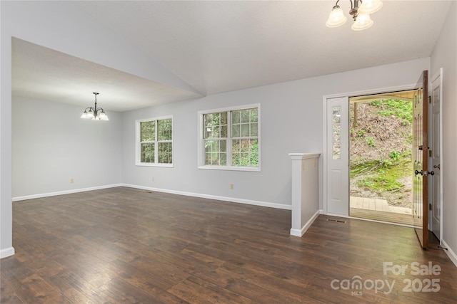 608 Surrey Glen Cir, Hendersonville, NC 28739 - entrance foyer featuring a chandelier, dark wood finished floors, baseboards, and vaulted ceiling