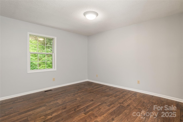 608 Surrey Glen Cir, Hendersonville, NC 28739 - spare room with dark wood-style floors, baseboards, and a textured ceiling