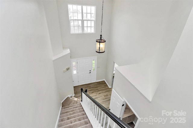 720 Reigate Rd, Charlotte, NC 28262 - entrance foyer with a towering ceiling, stairway, and wood finished floors