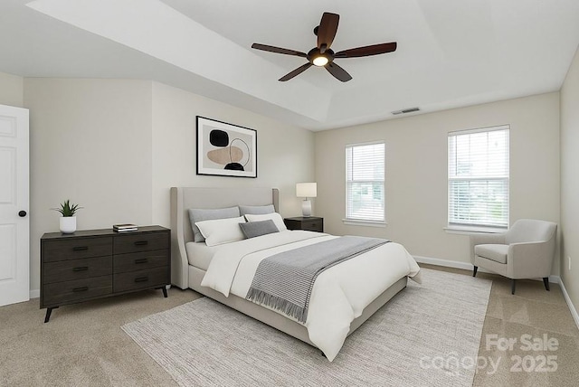 720 Reigate Rd, Charlotte, NC 28262 - bedroom with light carpet, a raised ceiling, and ceiling fan