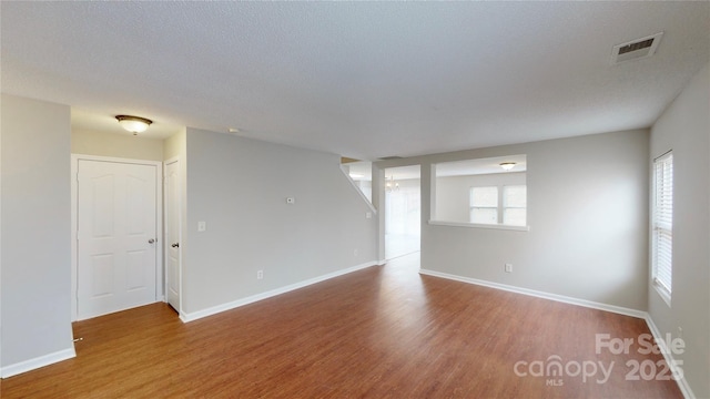 8139 Deodora Cedar Ln, Charlotte, NC 28215 - empty room with wood finished floors and baseboards