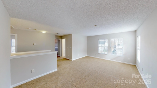 8139 Deodora Cedar Ln, Charlotte, NC 28215 - carpeted empty room with baseboards and a textured ceiling