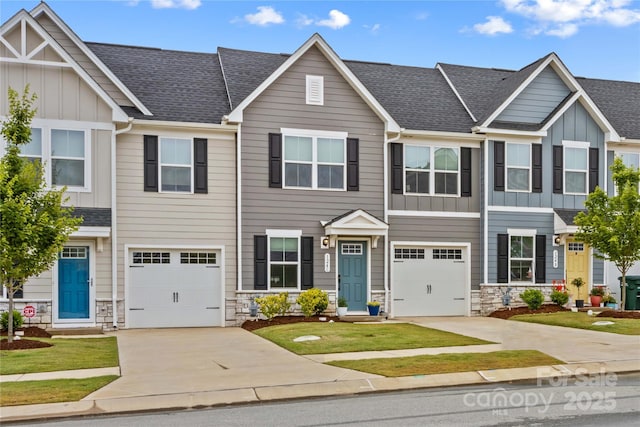 124 Kristin View Ln Unit C, Troutman, NC 28166 - townhome / multi-family property with concrete driveway, board and batten siding, stone siding, and an attached garage