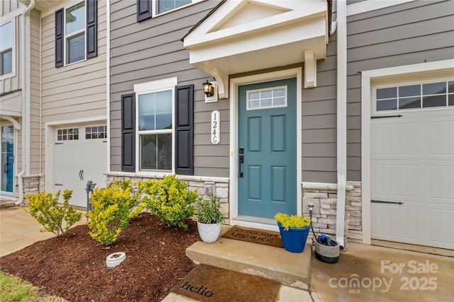 124 Kristin View Ln Unit C, Troutman, NC 28166 - view of exterior entry featuring stone siding and an attached garage