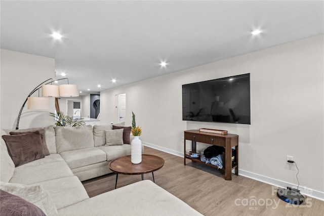 124 Kristin View Ln Unit C, Troutman, NC 28166 - living room featuring wood finished floors, baseboards, and recessed lighting