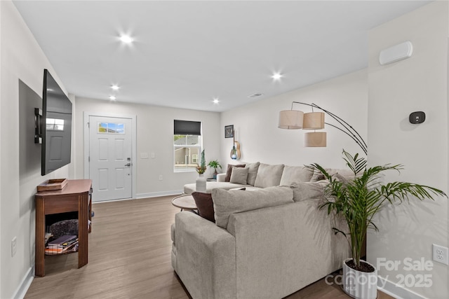 124 Kristin View Ln Unit C, Troutman, NC 28166 - living room with light wood-type flooring, baseboards, and recessed lighting