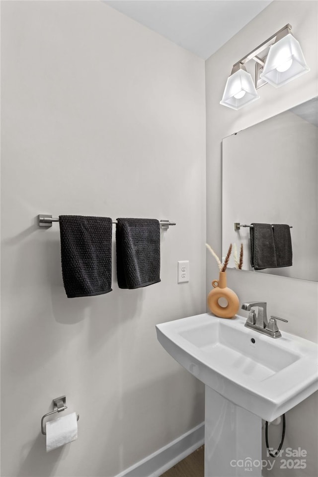 124 Kristin View Ln Unit C, Troutman, NC 28166 - bathroom featuring baseboards and a sink