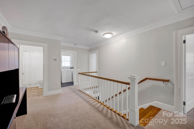 361 5th St NW, Hickory, NC 28601 - hall featuring washer and clothes dryer, an upstairs landing, crown molding, baseboards, and carpet floors