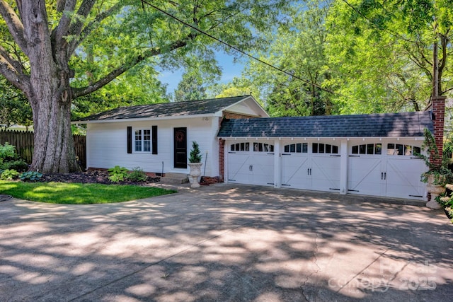 361 5th St NW, Hickory, NC 28601 - view of front of house featuring driveway, a garage, and roof with shingles