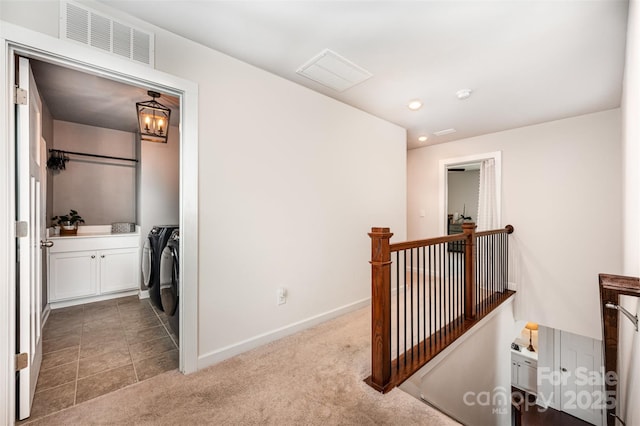 915 Claires Creek Ln, Davidson, NC 28036 - corridor featuring washing machine and clothes dryer, an upstairs landing, carpet flooring, and recessed lighting