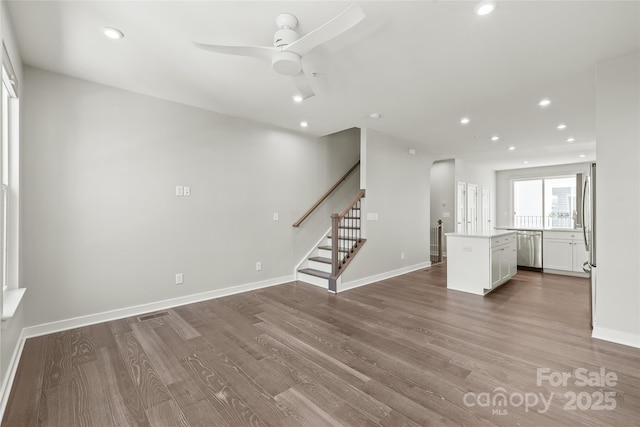 420 E 16th St, Charlotte, NC 28206 - unfurnished living room featuring stairs, wood finished floors, a ceiling fan, recessed lighting, and baseboards