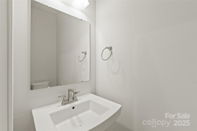 420 E 16th St, Charlotte, NC 28206 - half bath featuring a sink and toilet