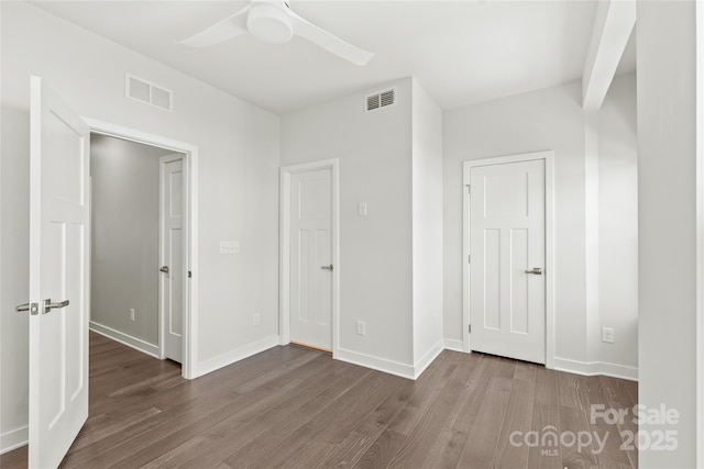 420 E 16th St, Charlotte, NC 28206 - unfurnished bedroom with wood finished floors, baseboards, and a ceiling fan