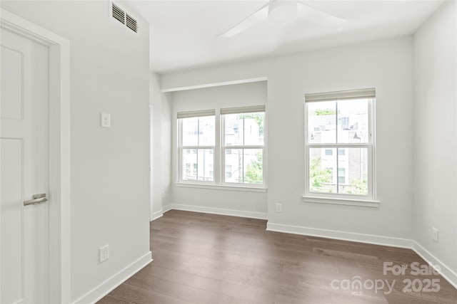 420 E 16th St, Charlotte, NC 28206 - unfurnished room with dark wood-style floors, ceiling fan, and baseboards