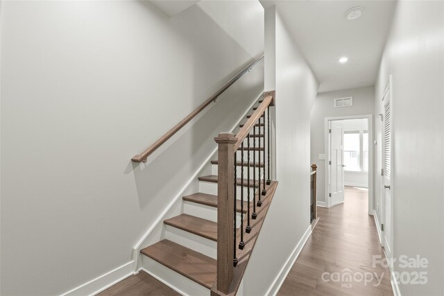 420 E 16th St, Charlotte, NC 28206 - stairs with wood finished floors, baseboards, and recessed lighting