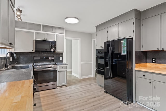 841 12th Ave NW, Hickory, NC 28601 - kitchen featuring black appliances, a sink, a warming drawer, and backsplash
