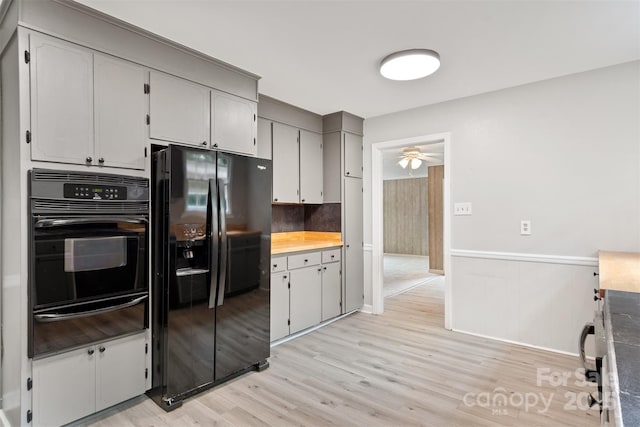 841 12th Ave NW, Hickory, NC 28601 - kitchen with black appliances, a warming drawer, ceiling fan, light wood finished floors, and backsplash