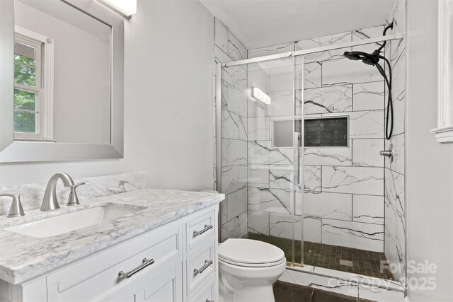 841 12th Ave NW, Hickory, NC 28601 - bathroom featuring vanity, toilet, and a marble finish shower