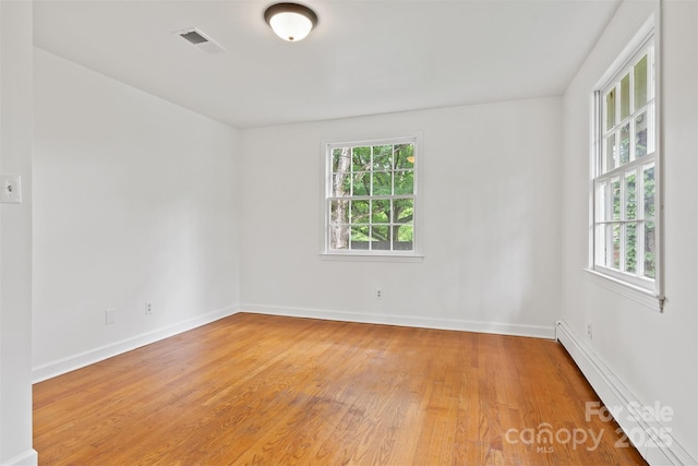 841 12th Ave NW, Hickory, NC 28601 - unfurnished room with light wood-style floors, baseboards, and baseboard heating