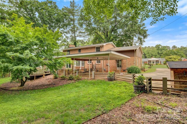 841 12th Ave NW, Hickory, NC 28601 - view of front of property featuring a chimney, a front yard, and brick siding