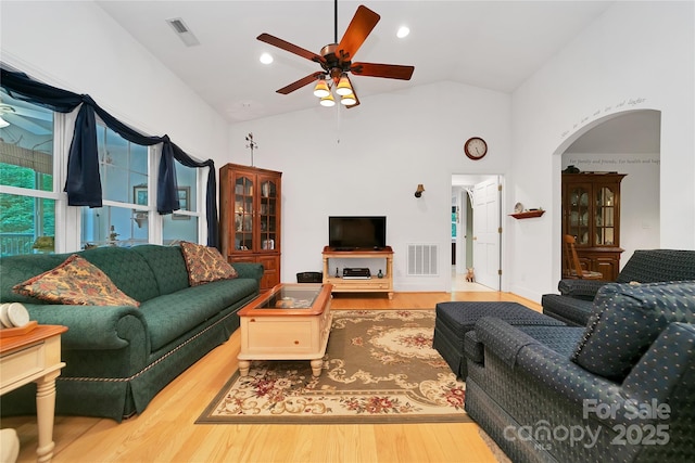 229 Hubbard Hollow Rd, Rosman, NC 28772 - living room featuring ceiling fan, wood finished floors, high vaulted ceiling, and arched walkways
