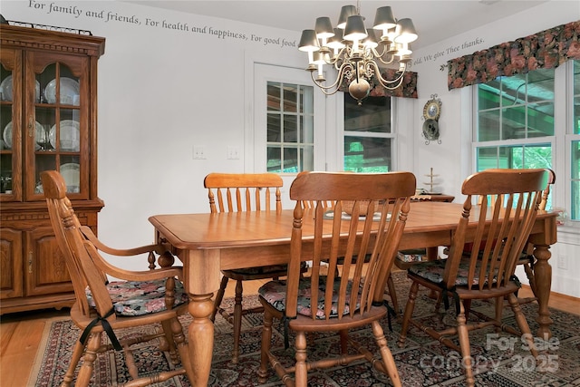 229 Hubbard Hollow Rd, Rosman, NC 28772 - dining area with a chandelier and light wood finished floors