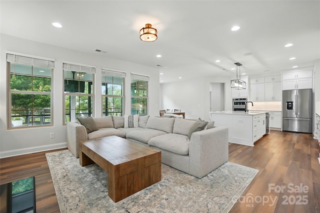 7322 Vesper Dr, Huntersville, NC 28078 - living room with recessed lighting and dark wood-style floors