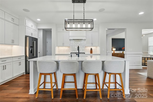 7322 Vesper Dr, Huntersville, NC 28078 - kitchen with high end fridge, backsplash, white cabinets, wainscoting, and recessed lighting