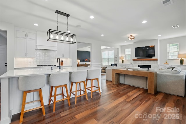 7322 Vesper Dr, Huntersville, NC 28078 - kitchen with light countertops, recessed lighting, plenty of natural light, white cabinets, and backsplash