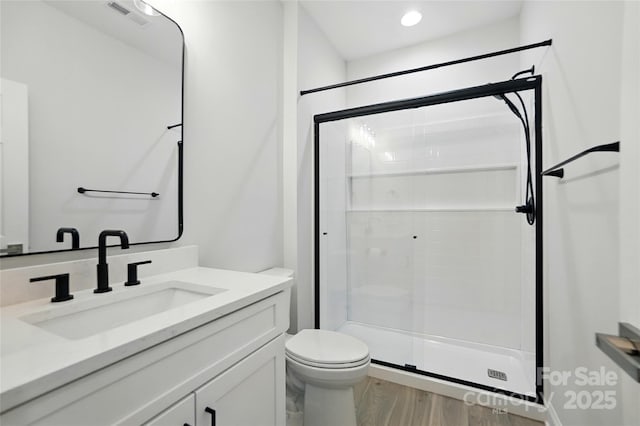 7322 Vesper Dr, Huntersville, NC 28078 - bathroom featuring vanity, a shower stall, and wood finished floors