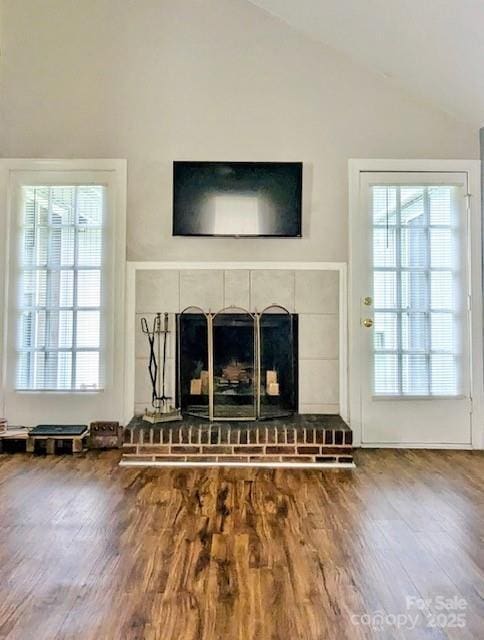 7133 Tall Tree Ln, Charlotte, NC 28214 - detailed view of a brick fireplace and wood finished floors