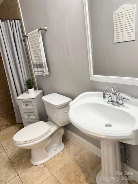7133 Tall Tree Ln, Charlotte, NC 28214 - full bath with toilet, tiled shower, tile patterned floors, and baseboards