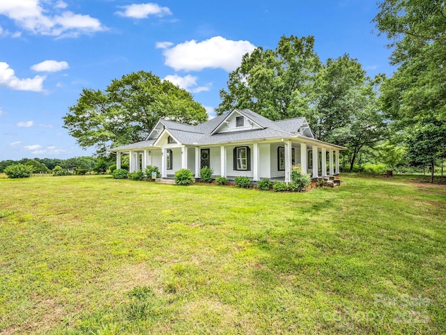 226 Dobbins Rd, Ellenboro, NC 28040 - farmhouse-style home with covered porch and a front lawn