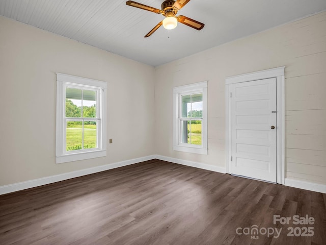 226 Dobbins Rd, Ellenboro, NC 28040 - empty room featuring dark wood-type flooring, a ceiling fan, and baseboards