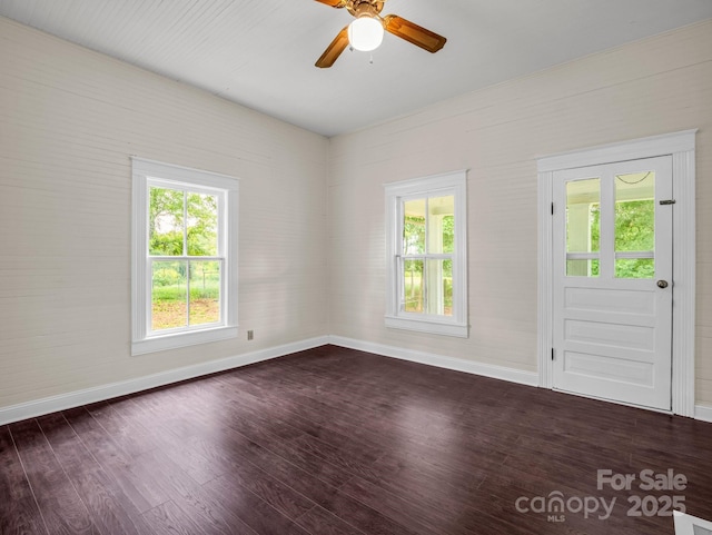 226 Dobbins Rd, Ellenboro, NC 28040 - empty room featuring dark wood-style flooring, baseboards, healthy amount of natural light, and ceiling fan