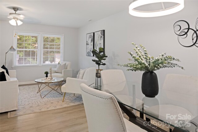 918 Creekridge Dr, Monroe, NC 28110 - dining room with light wood-style flooring, ceiling fan, and baseboards