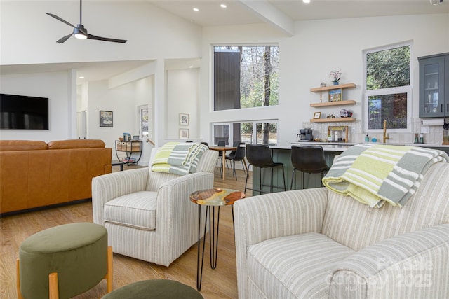 75 S Fork Trl, Lake Toxaway, NC 28747 - living area with high vaulted ceiling, ceiling fan, light wood-type flooring, recessed lighting, and beamed ceiling