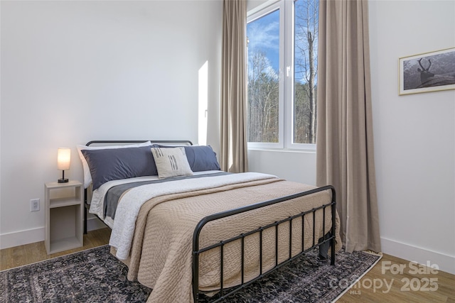 75 S Fork Trl, Lake Toxaway, NC 28747 - bedroom featuring wood finished floors and baseboards