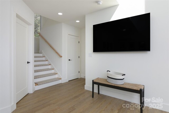 75 S Fork Trl, Lake Toxaway, NC 28747 - living area featuring wood finished floors, stairway, recessed lighting, and baseboards