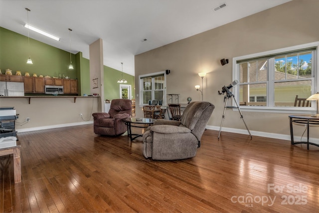 32 White Fox Dr, Fletcher, NC 28732 - living room featuring high vaulted ceiling, wood-type flooring, and baseboards